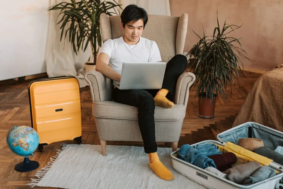 traveler planning an itinerary with maps and a notebook