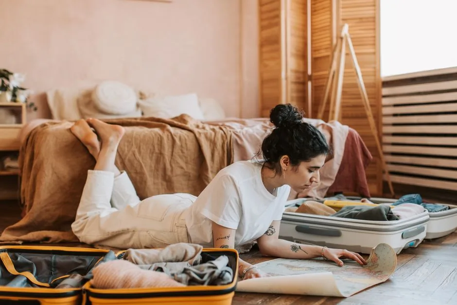 complete international travel checklist laid out on a bed
